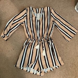 Black, gold, and white romper